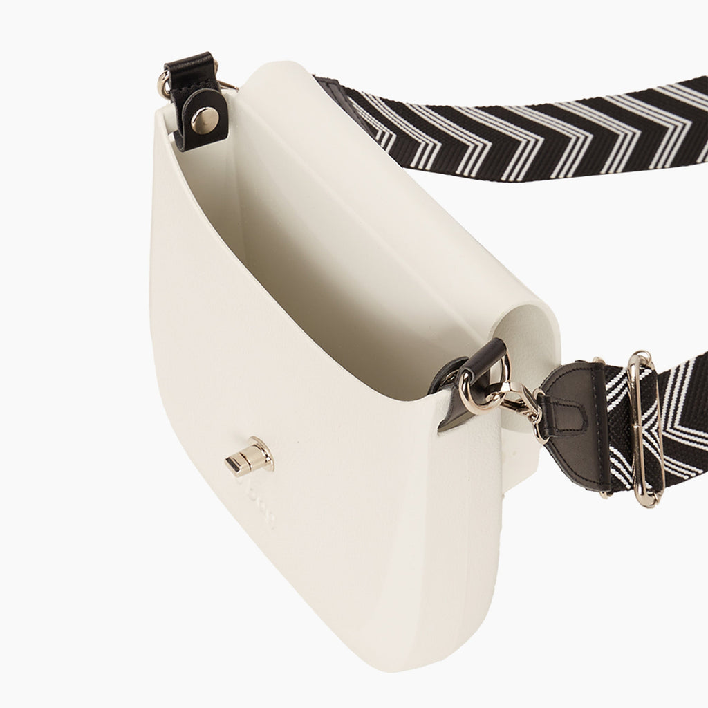O bag chase bag with adjustable fabric shoulder strap featuring a milk-colored arrow pattern